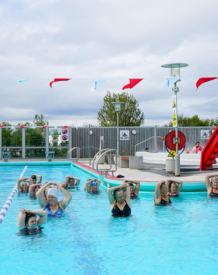 People in water aerobics at Vesturbærjarlaug pool