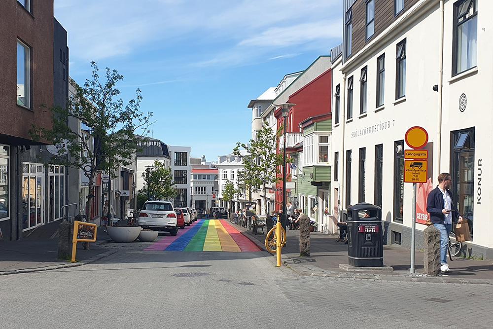 Looking down Skólavörðustígur street with rainbow colors.