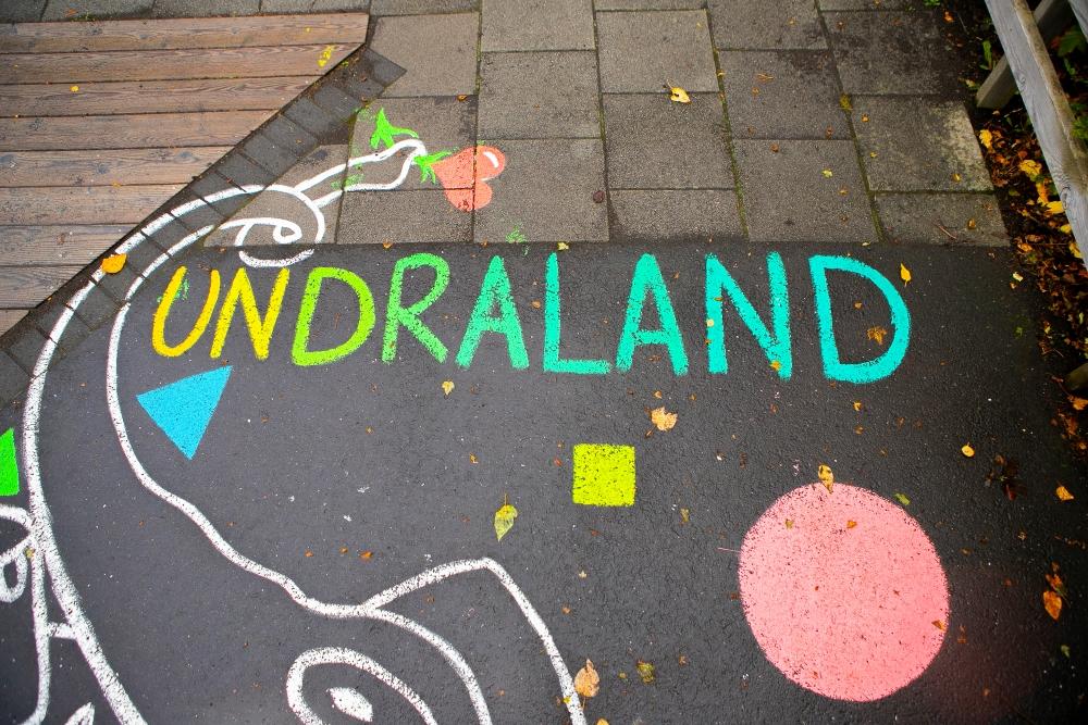 Chalk drawings on the pavement at Stakkaborg preschool grounds.