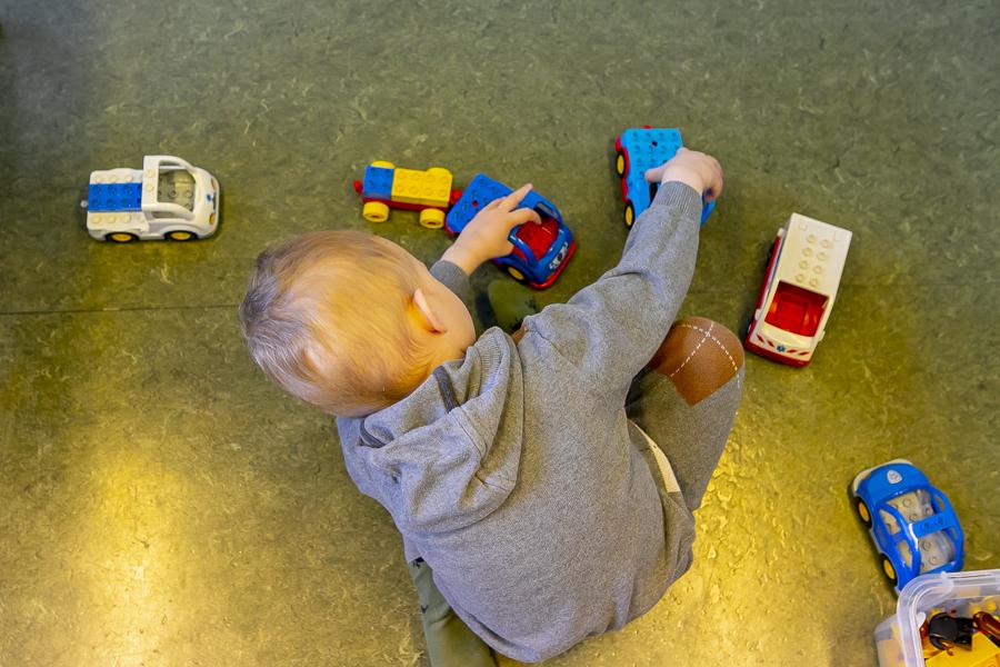 Child playing with cars at Suðurborg.