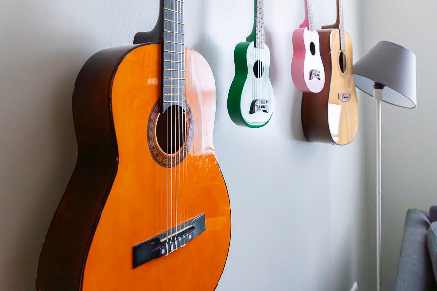 Guitars mounted on the wall. 