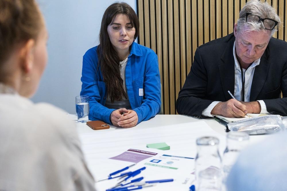 Workshop participants at tables.