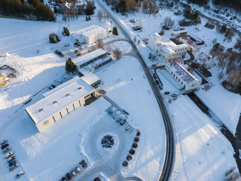 aerial view of Hitt húsið and the surrounding area, near the power station in Elliðaárdalur. Winter, snow.