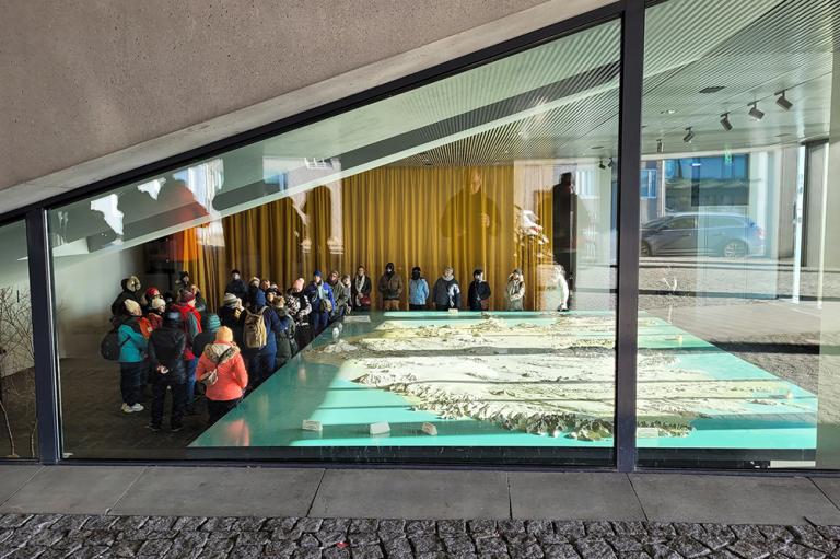 Photo of visitors viewing the Iceland Replica in Tjarnarsalur at Reykjavík City Hall.