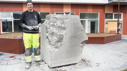 Man with stone.